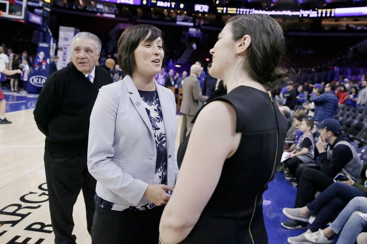 Amy Hever was an advancement officer with the Smithsonian when she found out about the Sixers' gig. She knew how to raise money. Was she ready to spend it? 